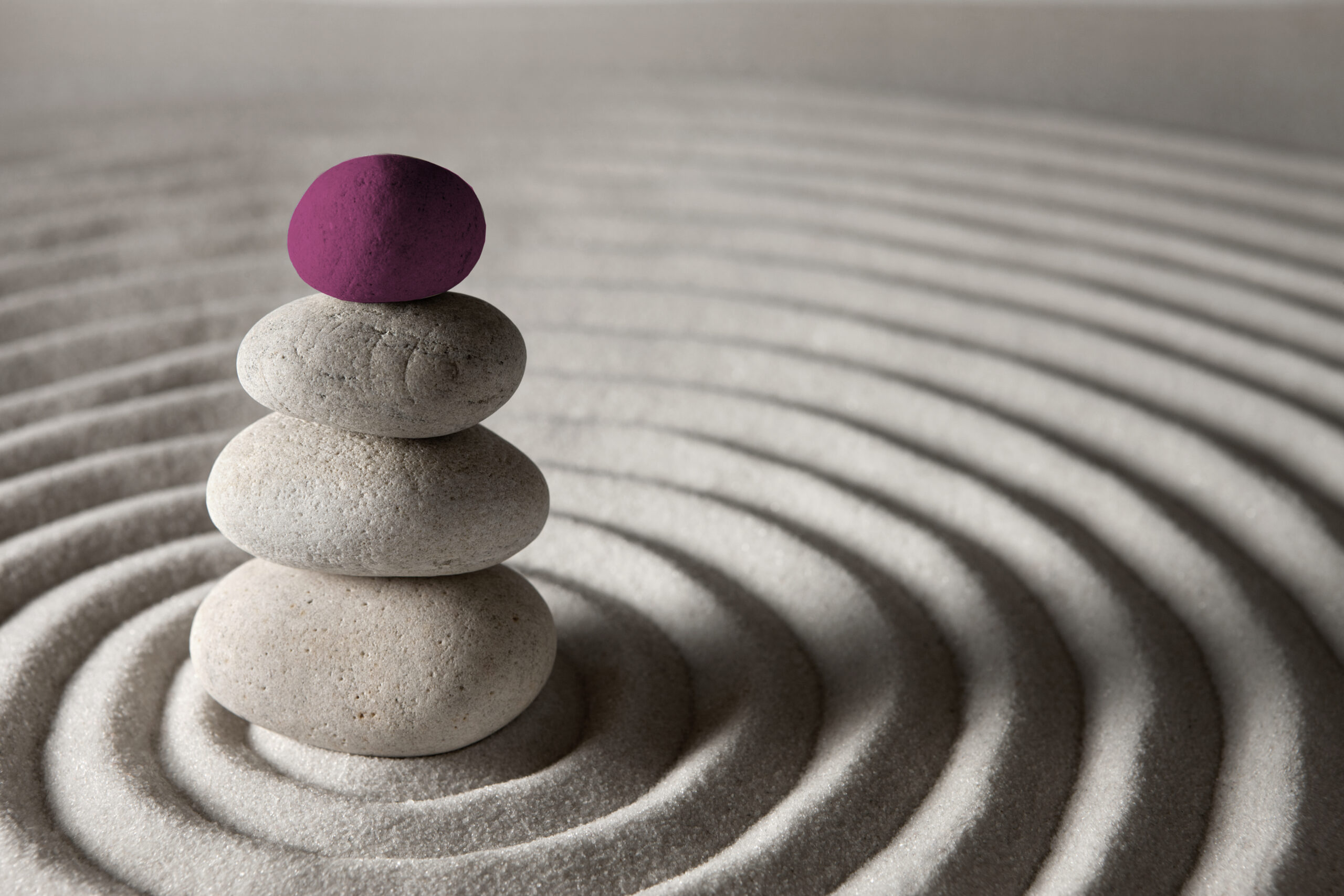 Stacked stones in a zen garden symbolising balance and stability—reflecting the need for fair and timely payment practices in UK business